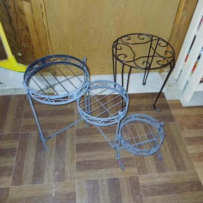 Three tiered adjustable plant stand with a larger plant stand