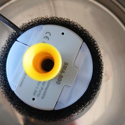 Pet drinking fountain - an automatic water / food dispenser and three little collars with bells -