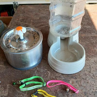 Pet drinking fountain - an automatic water / food dispenser and three little collars with bells -