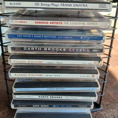 Music on CD - mostly Garth brooks - with an organizing stand