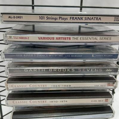 Music on CD - mostly Garth brooks - with an organizing stand