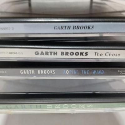 Music on CD - mostly Garth brooks - with an organizing stand