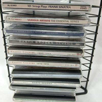 Music on CD - mostly Garth brooks - with an organizing stand