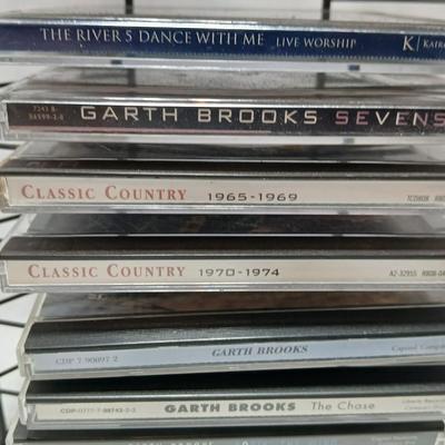 Music on CD - mostly Garth brooks - with an organizing stand