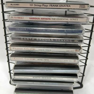 Music on CD - mostly Garth brooks - with an organizing stand
