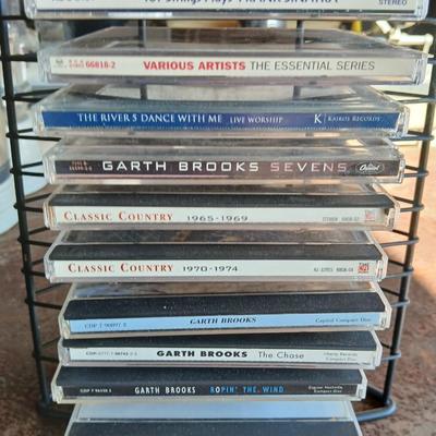 Music on CD - mostly Garth brooks - with an organizing stand