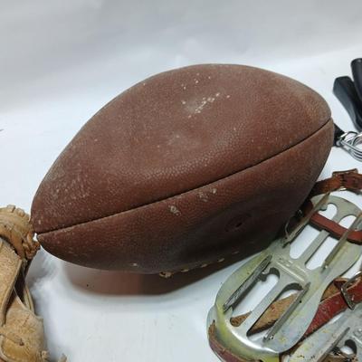 Vintage sporting - Antique metal ice skates, old football and a softball mitt