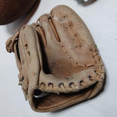 Vintage sporting - Antique metal ice skates, old football and a softball mitt
