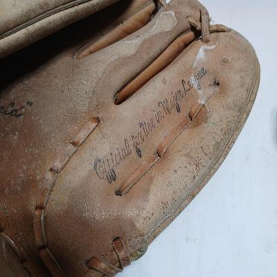 Vintage sporting - Antique metal ice skates, old football and a softball mitt
