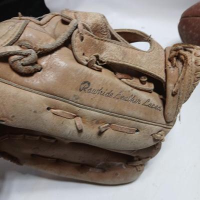 Vintage sporting - Antique metal ice skates, old football and a softball mitt