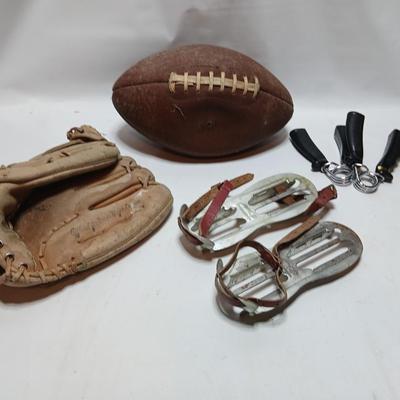 Vintage sporting - Antique metal ice skates, old football and a softball mitt
