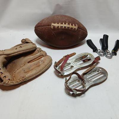 Vintage sporting - Antique metal ice skates, old football and a softball mitt