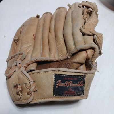 Vintage sporting - Antique metal ice skates, old football and a softball mitt