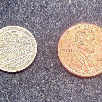 Sale Photo Thumbnail #411: Slightly smaller than a US dime.  Rare, in very good condition. ATC began operations in late 1950. This token is most likely an early 1950's version.