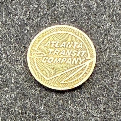 Sale Photo Thumbnail #409: Slightly smaller than a US dime.  Rare, in very good condition. ATC began operations in late 1950. This token is most likely an early 1950's version.