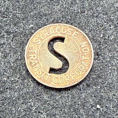 Sale Photo Thumbnail #412: Slightly smaller than a US dime.  Rare, in very good condition. STC began operations in late 1939. This token is most likely a 1940's or 1950's version.