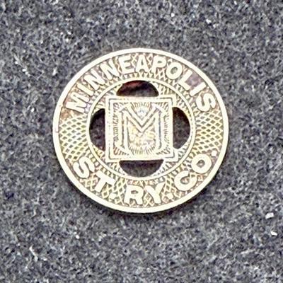 Sale Photo Thumbnail #420: Slightly smaller than a US dime. Rare, in very good condition. Minneapolis Street Railway Company ran from 1873 until about 1950.  This token is likely from the 1940's.