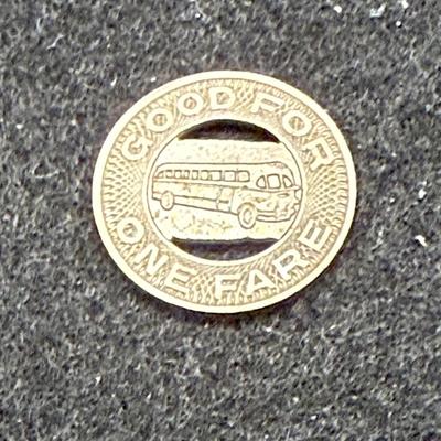 Sale Photo Thumbnail #424: Slightly smaller than a US dime. Rare, in very good condition. The Scranton Transit Company ran from 1934 until about 1972.  This token is likely from the late 1940's or 1950's.