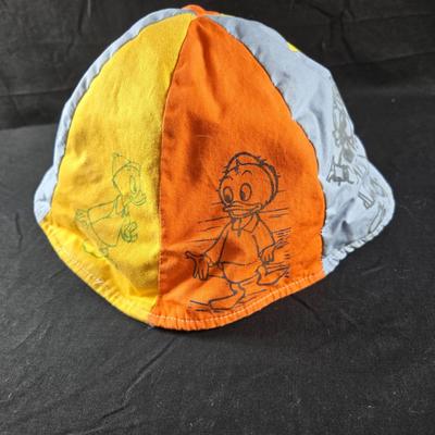 Sale Photo Thumbnail #74: This auction lot is for a Vintage Disney Land Child's Bucket Hat. This hat is a Vintage Disney Land Child's Bucket Hat.  It has been used but appears to have been cleaned and is in very good shape for it's age. Where you gonna find 'em.
