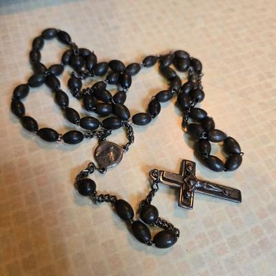 Sale Photo Thumbnail #88: This auction lot is for a Dark Grey Beaded Rosary.  This beaded rosary has France stamped into the back of the cross.  It is in very good condition, Appears to be quite vintage