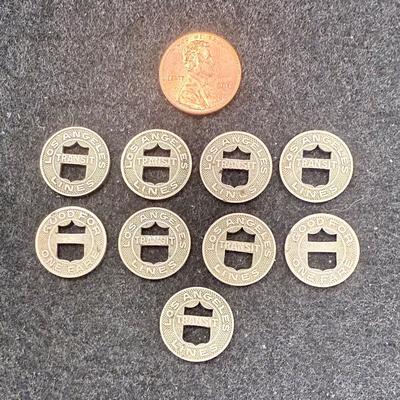 Sale Photo Thumbnail #427: Lot of 9 transit tokens. Slightly smaller than a US dime. Rare, in very good condition. The Los Angeles Transit Lines ran from 1944 until about 1963, using rail cars which were fully replaced by busses at that time. These tokens are likely from the mid 19