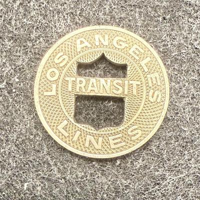 Sale Photo Thumbnail #428: Lot of 9 transit tokens. Slightly smaller than a US dime. Rare, in very good condition. The Los Angeles Transit Lines ran from 1944 until about 1963, using rail cars which were fully replaced by busses at that time. These tokens are likely from the mid 19