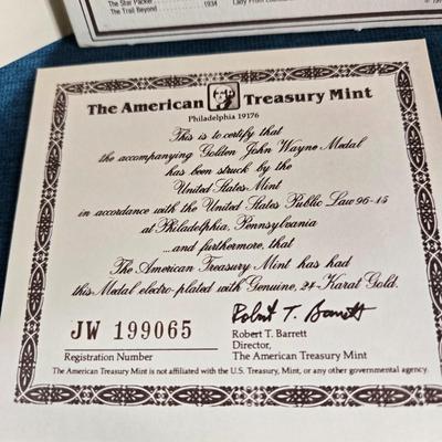 Sale Photo Thumbnail #113: This auction lot is for a Commemorative John Wayne Collector's Coin.  It is complete and has his history, certificate of authenticity and the coin.  The is coin is electroplated with 24 Karat Gold.  Registration number is JW 199065.  Where you gonna find 