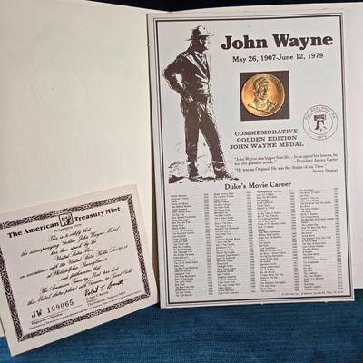 Sale Photo Thumbnail #117: This auction lot is for a Commemorative John Wayne Collector's Coin.  It is complete and has his history, certificate of authenticity and the coin.  The is coin is electroplated with 24 Karat Gold.  Registration number is JW 199065.  Where you gonna find 