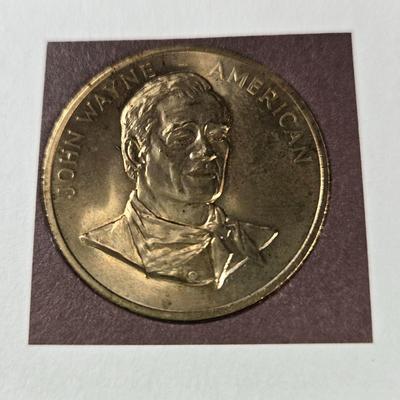 Sale Photo Thumbnail #119: This auction lot is for a Commemorative John Wayne Collector's Coin.  It is complete and has his history, certificate of authenticity and the coin.  The is coin is electroplated with 24 Karat Gold.  Registration number is JW 199065.  Where you gonna find 