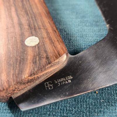 Sale Photo Thumbnail #122: This auction lot is for a very unique Chef's Bread Knife Saw.  The wood handle and stainless steel blade are in very good condition and it is sharp. It is stamped Japan.   It measures about 10.5-inches long and 5-inches wide.  Perfect for the handyman who