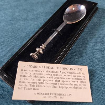 Sale Photo Thumbnail #123: This auction lot is for a Elizabeth I Seal Top Spoon Replica.  This is a nifty replica of the Queen Elizabeth I Seal Top Spoon.  It includes paperwork about it and is in it's original box.  Great addition for all Spoon or monarchy Collector.  Use it to se