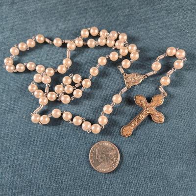 Sale Photo Thumbnail #92: This auction lot is for a Faux Pearl Beaded Rosary.  The beads are a bit larger than most rosaries.  There are no marks on the cross as to where it was made but it is pretty all the same.  It is in very good condition.