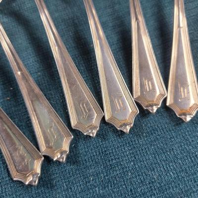 Sale Photo Thumbnail #136: This auction lot is for a Set of 6 Sterling Silver Teaspoons. These sterling silver teaspoons are pattern 1911 Plymouth by Gorham.  They have a monogram, which we believe to be an F on the handles - but it is very decorative and hard to discern..  They ar