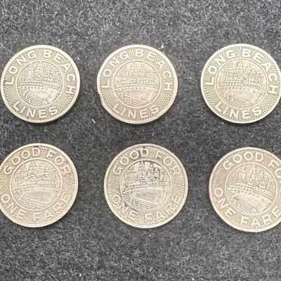 Sale Photo Thumbnail #430: Lot of 6 transit tokens. Slightly smaller than a US dime. Rare, in very good condition. The Long Beach Lines ran from 1902 until 1961, using Pacific Electric "Red Cars" which were fully replaced by busses in 1961. These tokens are likely from the mid 1940