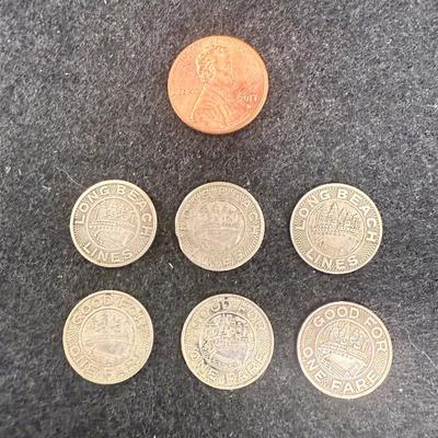 Sale Photo Thumbnail #431: Lot of 6 transit tokens. Slightly smaller than a US dime. Rare, in very good condition. The Long Beach Lines ran from 1902 until 1961, using Pacific Electric "Red Cars" which were fully replaced by busses in 1961. These tokens are likely from the mid 1940