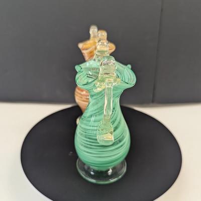 Sale Photo Thumbnail #985: The green vase has a shape edge on the top of the handle.  It is not chipped appears to be made that way
