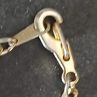 Two gold tone necklaces a pair of earrings and a vintage Victoria Rhein quartz watch