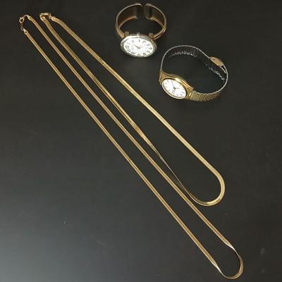 Two thick herringbone gold toned necklaces with two vintage watches one with gold electroplate Bulova band