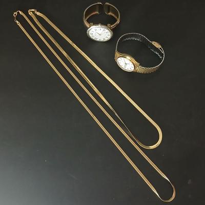 Two thick herringbone gold toned necklaces with two vintage watches one with gold electroplate Bulova band