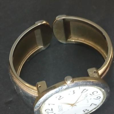 Two thick herringbone gold toned necklaces with two vintage watches one with gold electroplate Bulova band