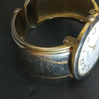 Two thick herringbone gold toned necklaces with two vintage watches one with gold electroplate Bulova band