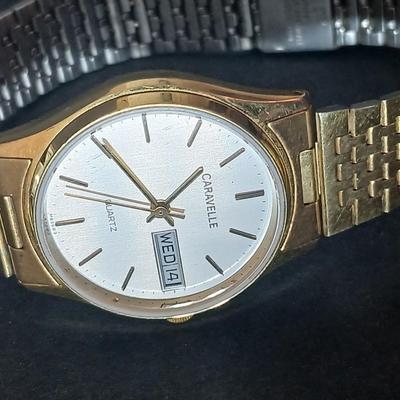Two thick herringbone gold toned necklaces with two vintage watches one with gold electroplate Bulova band