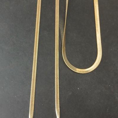 Two thick herringbone gold toned necklaces with two vintage watches one with gold electroplate Bulova band