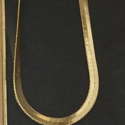 Two thick herringbone gold toned necklaces with two vintage watches one with gold electroplate Bulova band