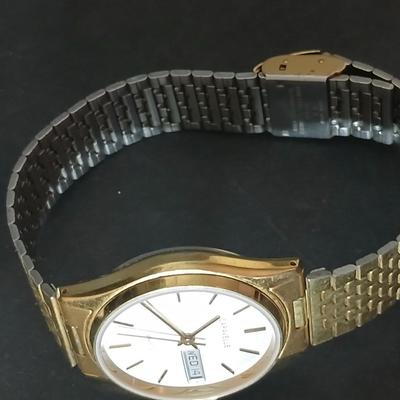 Two thick herringbone gold toned necklaces with two vintage watches one with gold electroplate Bulova band