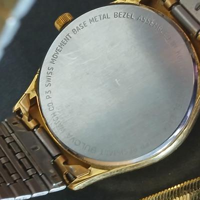Two thick herringbone gold toned necklaces with two vintage watches one with gold electroplate Bulova band