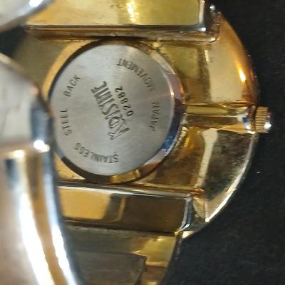 Two thick herringbone gold toned necklaces with two vintage watches one with gold electroplate Bulova band
