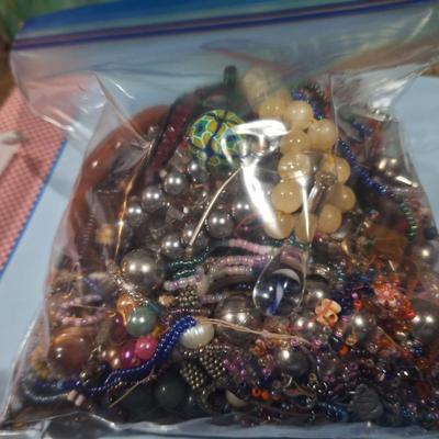 Sale Photo Thumbnail #477: bag of jewelry pieces, broken jewelry mismatched earrings etc  weighs over 3 pounds