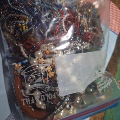 Sale Photo Thumbnail #479: bag of jewelry pieces, broken jewelry mismatched earrings etc  weighs over 3 pounds
