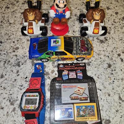 Sale Photo Thumbnail #150: Rare Zelta N64 Diecast Racecar along with other Nintendo memorbilia.
